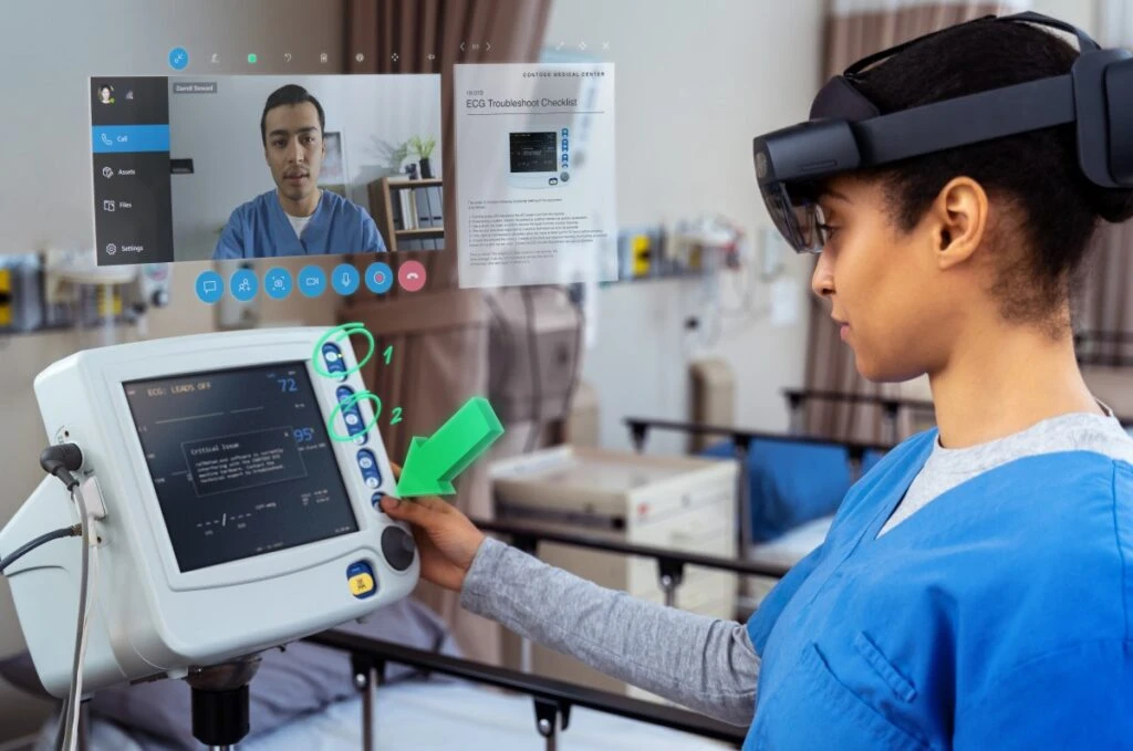 A nurse using Dynamics 365 Remote Assist on HoloLens 2 to collaborate with a remote expert in real-time to troubleshoot a piece of equipment.