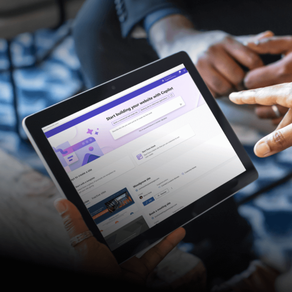 Close-up of hands holding a tablet.