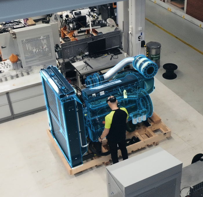 Overhead view of a person looking at a large piece of equipment.